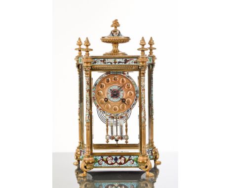 MID-19TH CENTURY FRENCH CHAMPLEVE ENAMEL FOUR GLASS CLOCK
the concave case surmounted by urn and rosebud finials, circular Ar