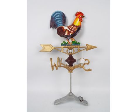A cast iron weather vane with cockerel surmount, approximately 73 cm (h), appears in good condition (this does not constitute