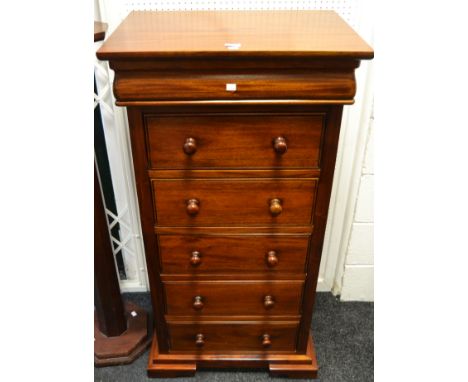 A contemporary mahogany chest of one blind drawer to frieze above five long drawers, stepped plinth base, bracket feet