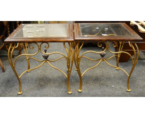 A pair of mid 20th Century mahogany glazed top coffee tables, gilded wrought iron supports, X frame stretcher surmounted by s