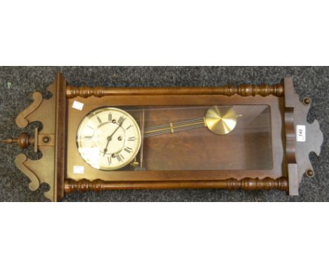 A Vienna style drop pendulum wall clock; a pair of fireside bellows; a brass gimble oil lamp