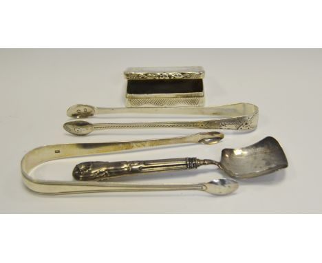 A Victorian silver snuff box, Birmingham 1859; a pair of Georgian sugar bows; silver caddy spoon , Birmingham 1829