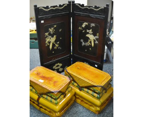 A pair of glazed terracotta conservatory stools ; a two fold Shibayama screen (3)