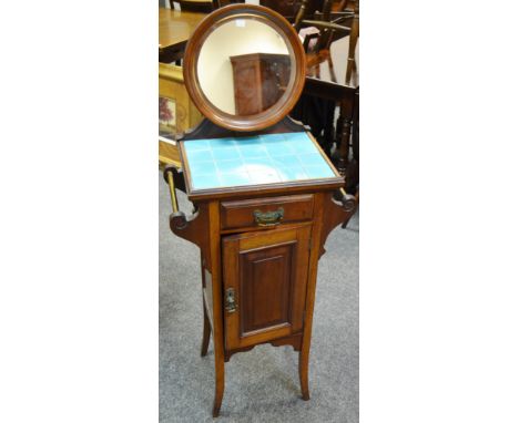 An unusual Art Nouveau ladies wash stand surmounted with circular looking glass, projecting base inlaid with turquoise tiles,