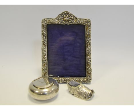 A silver photograph frame, Birmingham 1902; a silver box Birmingham 1939; a shoe pin cushion 