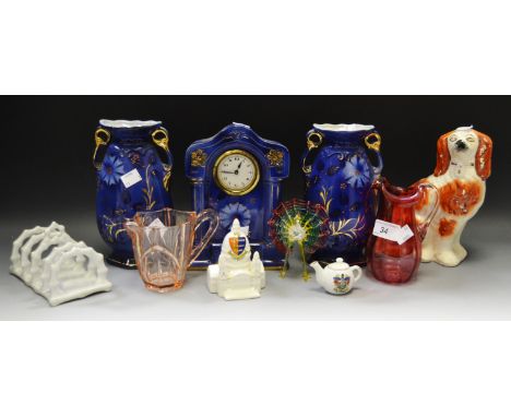 A Victorian clock garniture; a Staffordshire mantel dog; Crested Ware; cranberry glass jug; copper lustre jug; glass animals;