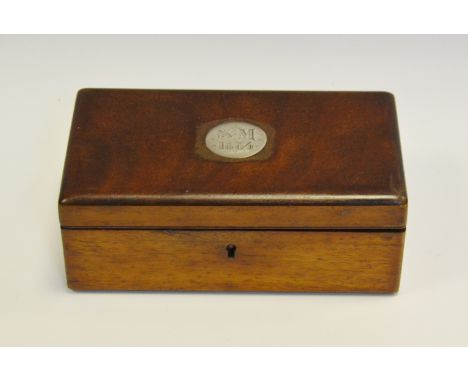 A Victorian mahogany box, hinged cover with inset silver coloured metal roundel, dated 1884