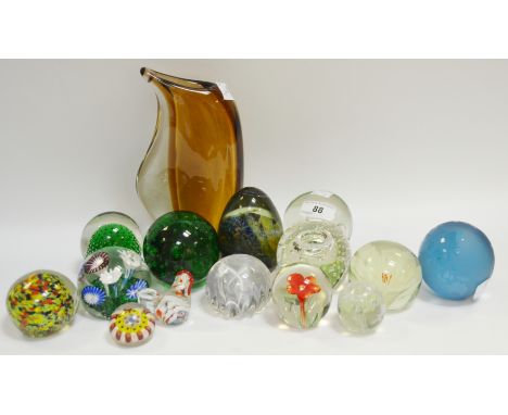 Glass - a Caithness Magic Circle glass paperweight; a Mille Fiore glass paperweight; others; a sinuous amber glass vase;  etc