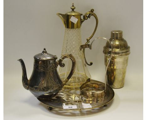 An Edwardian cut glass claret jug; an Art Nouveau W.M.F teapot; an American expanding dish coaster; a bottle cradle; a cockta