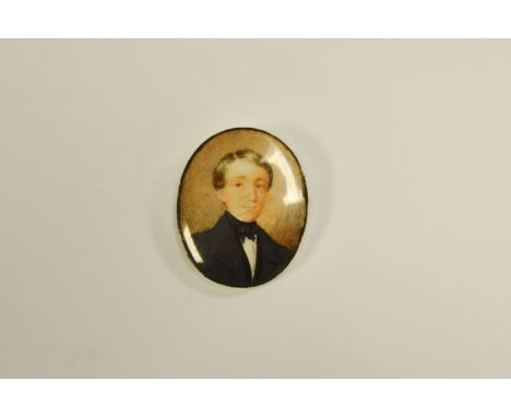 English School (19th century), a portrait miniature, of a young gentleman, watercolour on ivory, mounted in silver coloured m