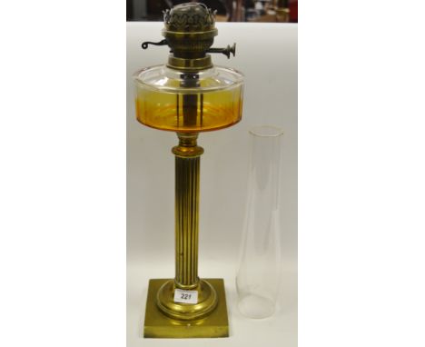  A Victorian brass Doric column oil lamp, glass reservoir, with chimney 