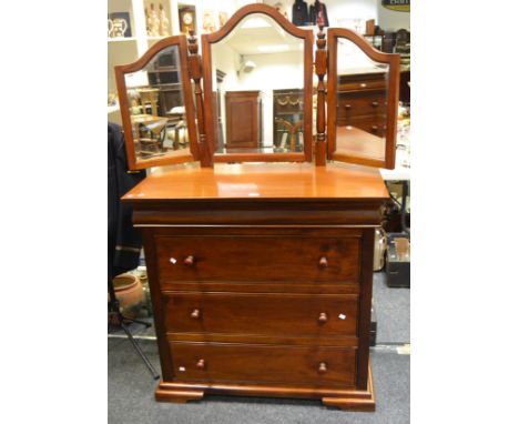 A contemporary mahogany dressing chest of one blind drawer to frieze, above three long drawers, stepped plinth base, bracket 