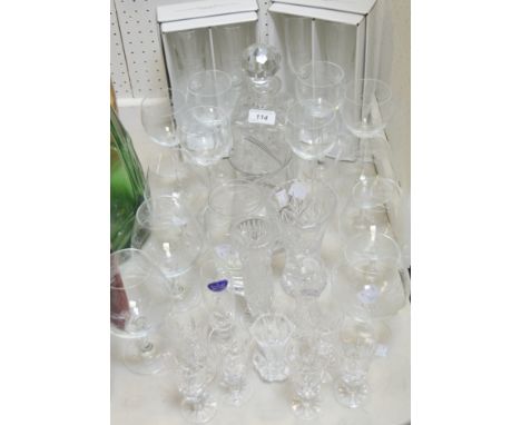 Glassware - a set of six brandy glasses and wine glasses, engraved with ribbon tied baskets;  a cut glass decanter;  six port