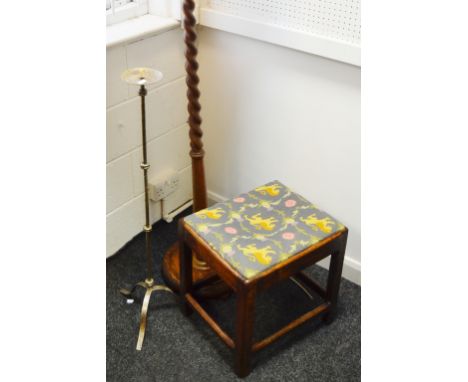 An early 20th Century oak barley twist standard lamp' an early 19th Century oak piano stool, embroidered seat; a wrought iron