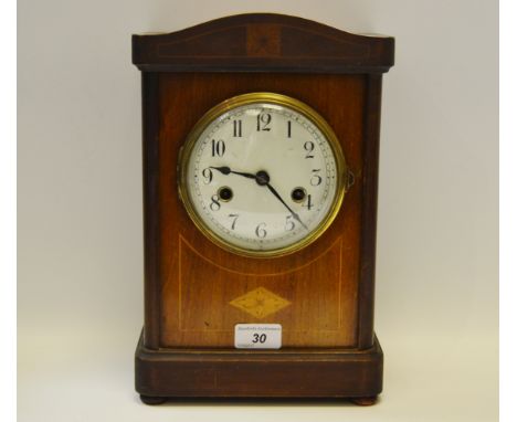 An Edwardian mantel clock, enamel dial, twin winding holes, central diamond shaped satinwood patera, retailed by J Sermin Ltd