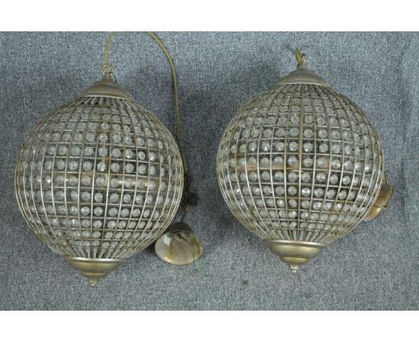A pair of spherical beaded crystal glass and metal  light fittings. H.70 cm. 