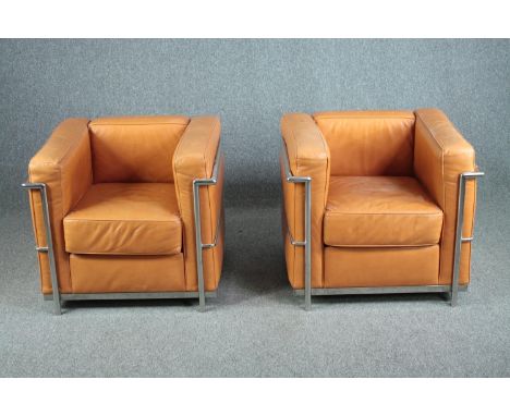 After Le Corbusier, a pair of LC2 armchairs upholstered in light tan leather. H.56 W.76 D.70cm. (each) 