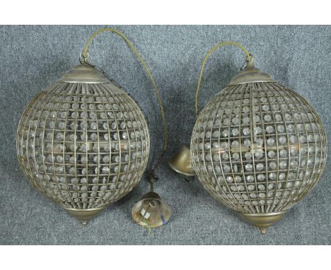 A pair of spherical beaded crystal glass and metal pendant light fittings. H.70cm. 