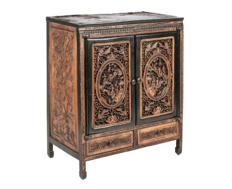 * Table Cabinet. An early 20th century Chinese wooden table cabinet, a combination of dark and light wood, the two hinged doo