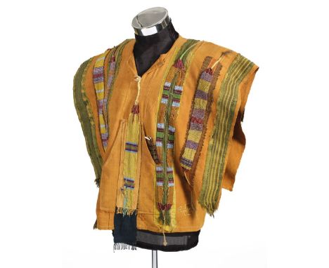 * Native American. A beaded tunic, late 19th/early 20th century, hand-stitched thick orange cotton tunic, with wide openings 