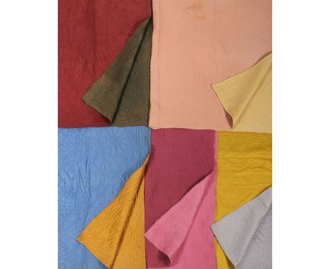* Quilts. A collection of Welsh quilts, early 20th century, 5 double-sided Welsh quilts, comprising: a raspberry/pink quilt, 