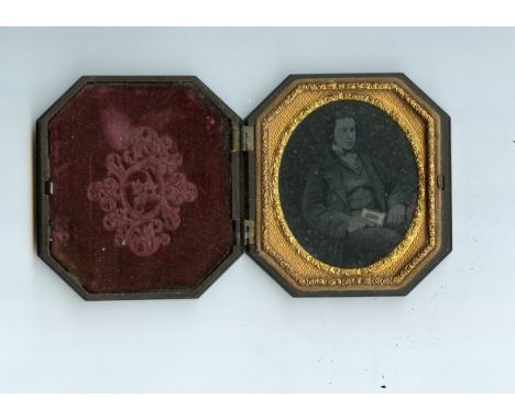 A Littlefield Parsons and Co ninth-plate Floral Union Case,  ambrotype, seated young man, P