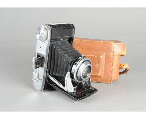 A Kershaw Curlew-III 6 x 9cm Folding Camera, serial no No 3/7651, body F, leatherette missing from back and one side, with a 