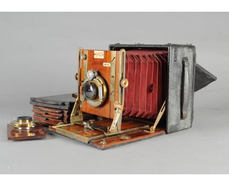 A Sanderson Regular Hand &amp; Stand Half Plate Camera, serial no 9475, red bellows, condition F, careful repairs to bellows,