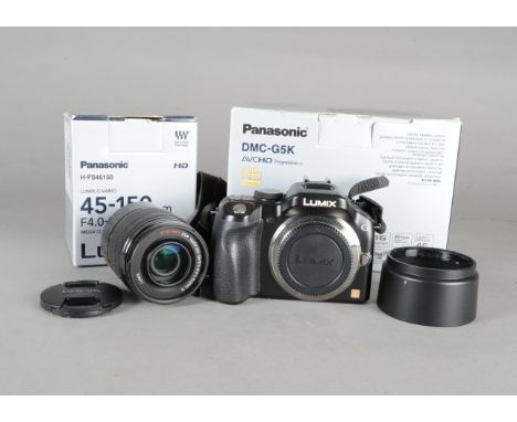 A Panasonic Lumix DMC-G5 Four Thirds CSC Camera, serial no WE2JA001081, working, condition VG, in maker's box, a Lumix G Vari