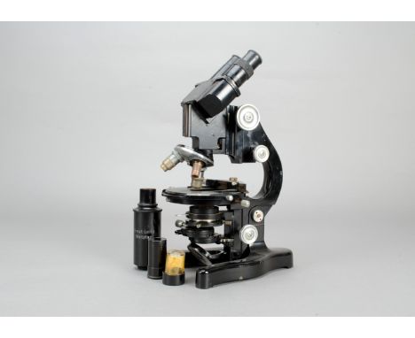 A Leitz black-enamelled Compound Binocular Microscope, serial no. 309110, with eyepieces (5), objectives, in cans (2), detach