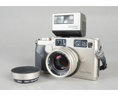 A Contax G2 Rangefinder Autofocus Camera, serial no 032967, shutter working, body VG, with a Carl Zeiss Planar T* 45mm f/2 le