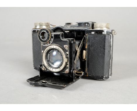 A Zeiss Ikon Super Nettel Folding Camera, serial no Y 31021, with a Carl Zeiss Jena Tessar 5cm f/2.8 lens, shutter working, b