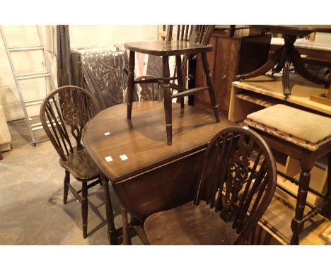 Oval oak drop leaf gate leg dining table with four matching wheel back chairs. Not available for in-house P&amp;P, contact Pa