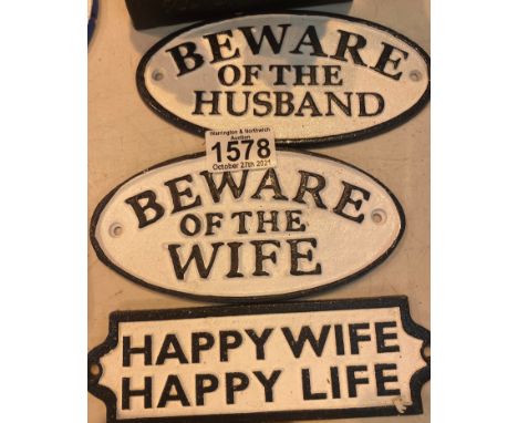 Three cast iron signs, Beware of the husband, Beware of the wife, Happy wife happy life, L: 17 cm. P&amp;P Group 1 (£14+VAT f