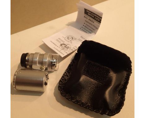 Jewellery detecting 60x loupe with LED light, in leather case. P&amp;P Group 1 (£14+VAT for the first lot and £1+VAT for subs