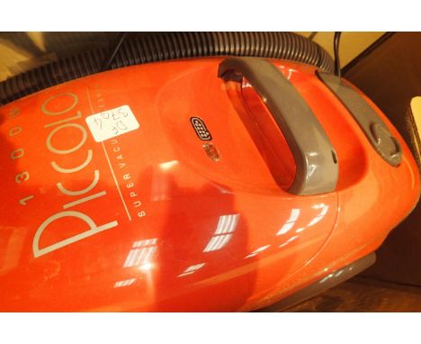 Boxed Piccolo 1300w five stage filter vacuum cleaner with nozzle head attachments. Not available for in-house P&P, contact Pa