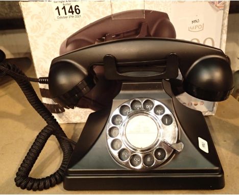 The GPO 200 rotary telephone has a metal base and handset; traditional cloth handset curly cord &amp; is compatible with stan