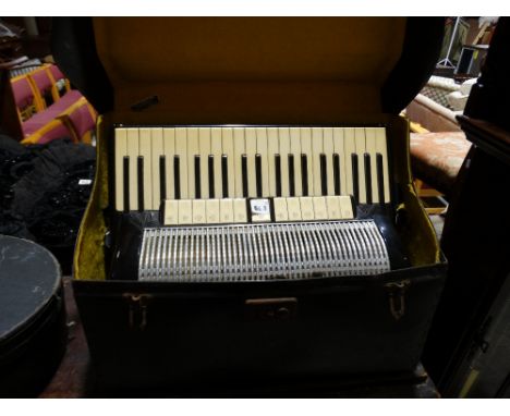 A Cased Black & Ivory Finish Dallape Accordion