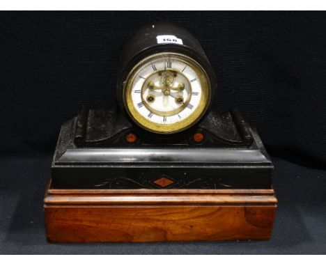 A Victorian Black Marble Encased Mantel Clock With Circular White Enamel Dial