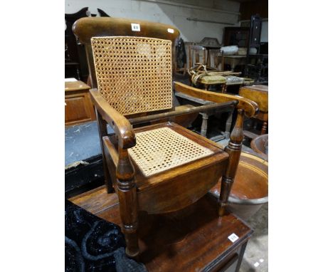 A Late Victorian Cane Backed Childs Commode Elbow Chair