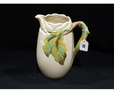 A Clarice Cliff Moulded Pottery Water Jug With Branch &amp; Leaf Stylised Handle, 9.5" High