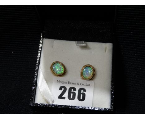 A Pair Of Gold Framed Opal Set Earrings