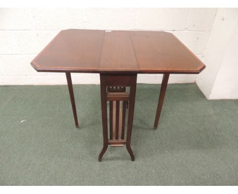 A Sheraton Revival crossbanded mahogany Sutherland table on original ceramic casters 61cm x 74cm extended 