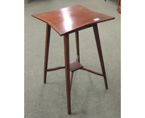 An early 20th Century mahogany occasional table with shaped square top and lower shelf with crossbanded and line inlaid decor