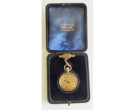An 18 k gold ladies fob watch. The case with engraved foliate decoration with initialled cartouche, the matt dial with black 