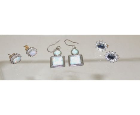 A pair of 9ct gold stud earrings, set with central Cabouchon opal with a surround of clear stones, another pair of stud earri