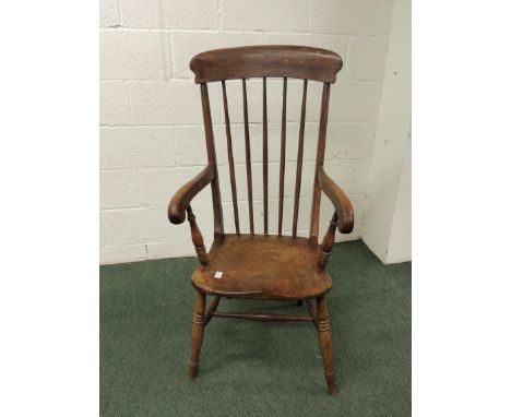 A 19th Century ash and elm Windsor stick back farmhouse chair.