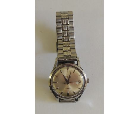 A gents steel cased "BAUME, INCABLOCK" wristwatch on steel strap. The silvered dial with silvered line numerals, date apertur