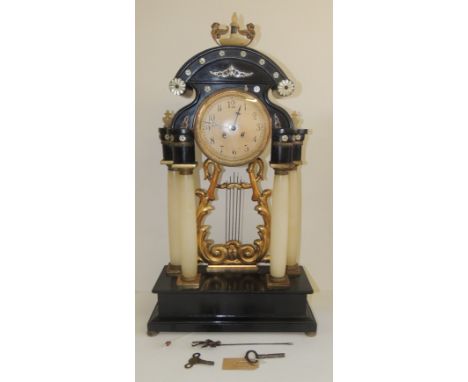 A 19th Century Austrian, four column potico mantel clock with Mother Of Pearl applied decoration to the ebonised case, with s
