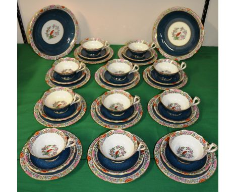 A Royal Worcester, Old Worcester Parrot Pattern part tea service: comprising of eleven teacups and saucers, eleven tea plates